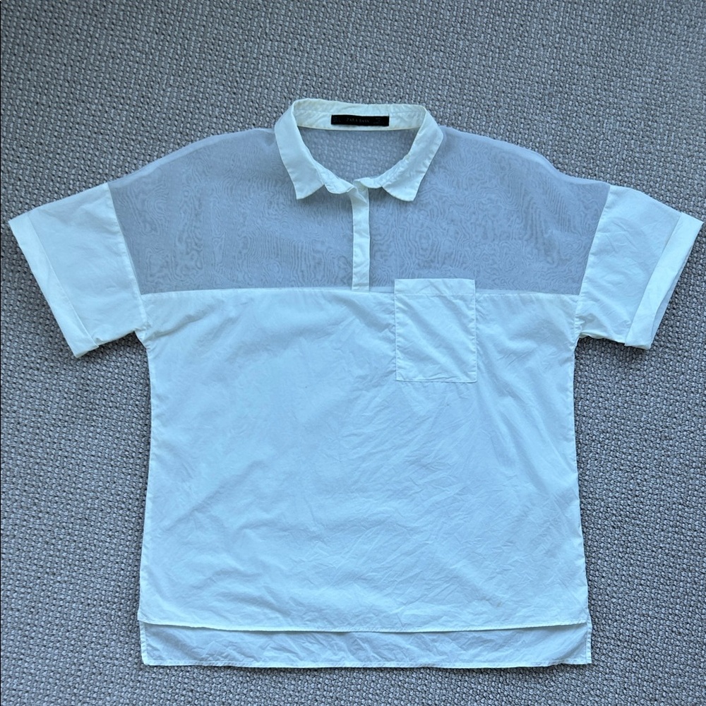 Zara Wimen’s White cotton Polo with Sheer Detail.